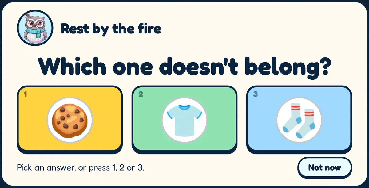 A puzzle question: “Which one doesn't belong?” with a cookie, a T-shirt and a pair of socks.